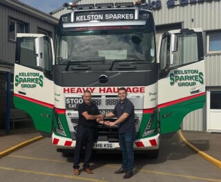 Justin Fisher of Stuarts Truck & Bus (left) handing the keys to Kelston Stark