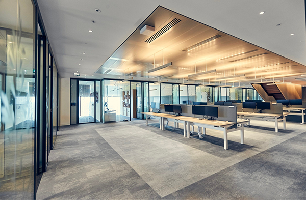 Interior office design involving a combination of open space and private offices presents soundproofing challenges.