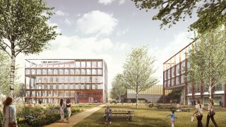 The Dirac Building, with multi-storey car park alongside (in the background)