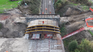 An arched framework was constructed to support the structure before it was moved away on an SPMT