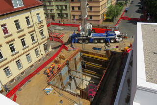 Slide rail systems can be used alongside sheets, to enable existing pipes to cross through a pit. Slide rail systems can be used alongside sheets, to enable existing pipes to cross through a pit.