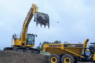 No hands: An operator shows of the automated loading feature of the new excavator No hands: An operator shows of the automated loading feature of the new excavator