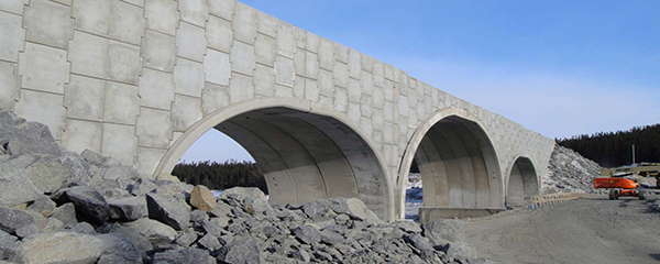 The BEBO system is comprised of modular precast concrete arch elements paired with cast-in-place or precast footings.